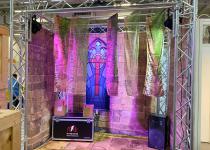 FE UK stand, aluminium rigging surround, with fabric draped walls on 3 sides