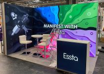 Essta back and side wall stand, with Lightbox counter and table/chairs