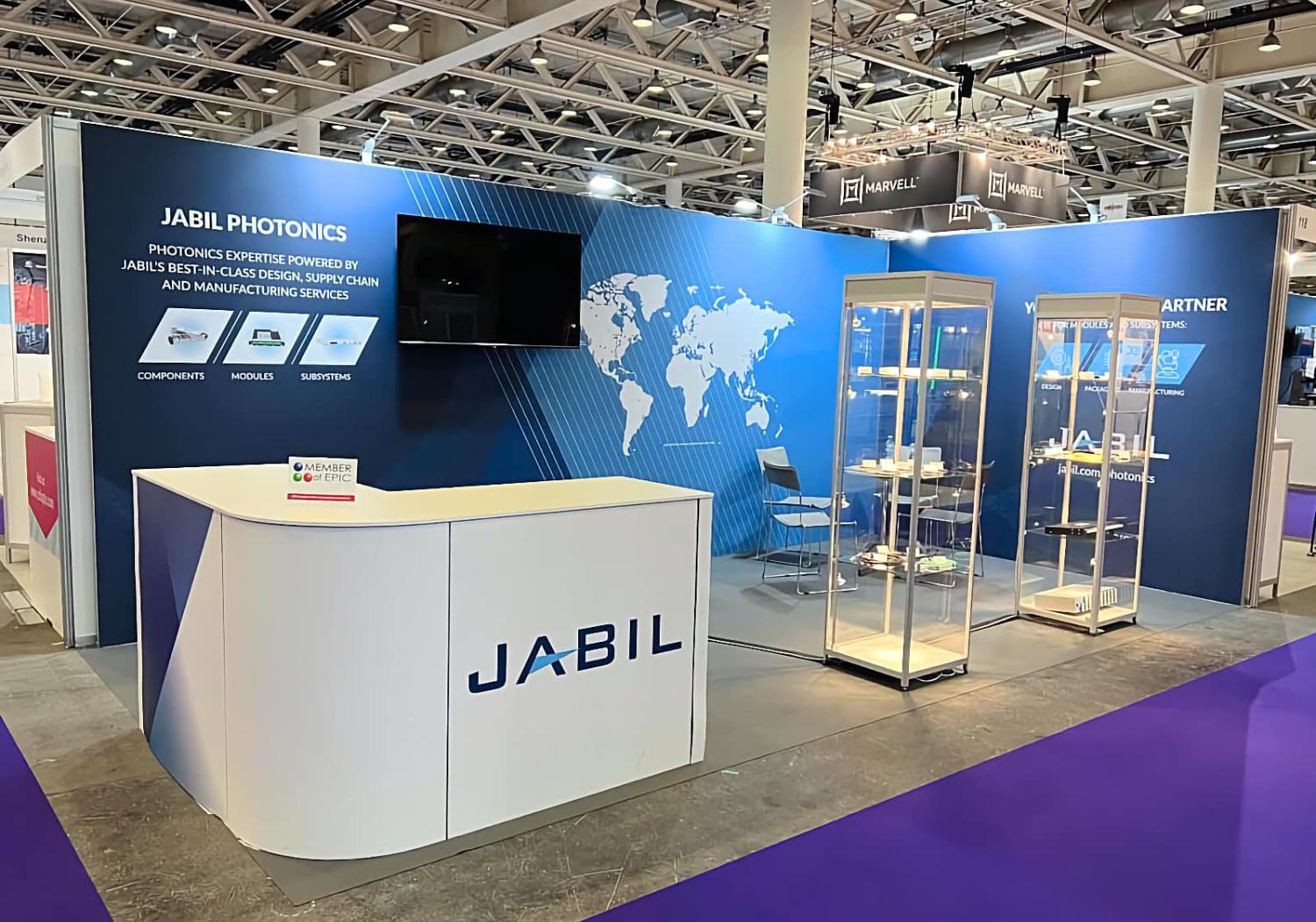 Stand for Jabil, 2 walls, 2 glass display towers, and a curved L-shape counter